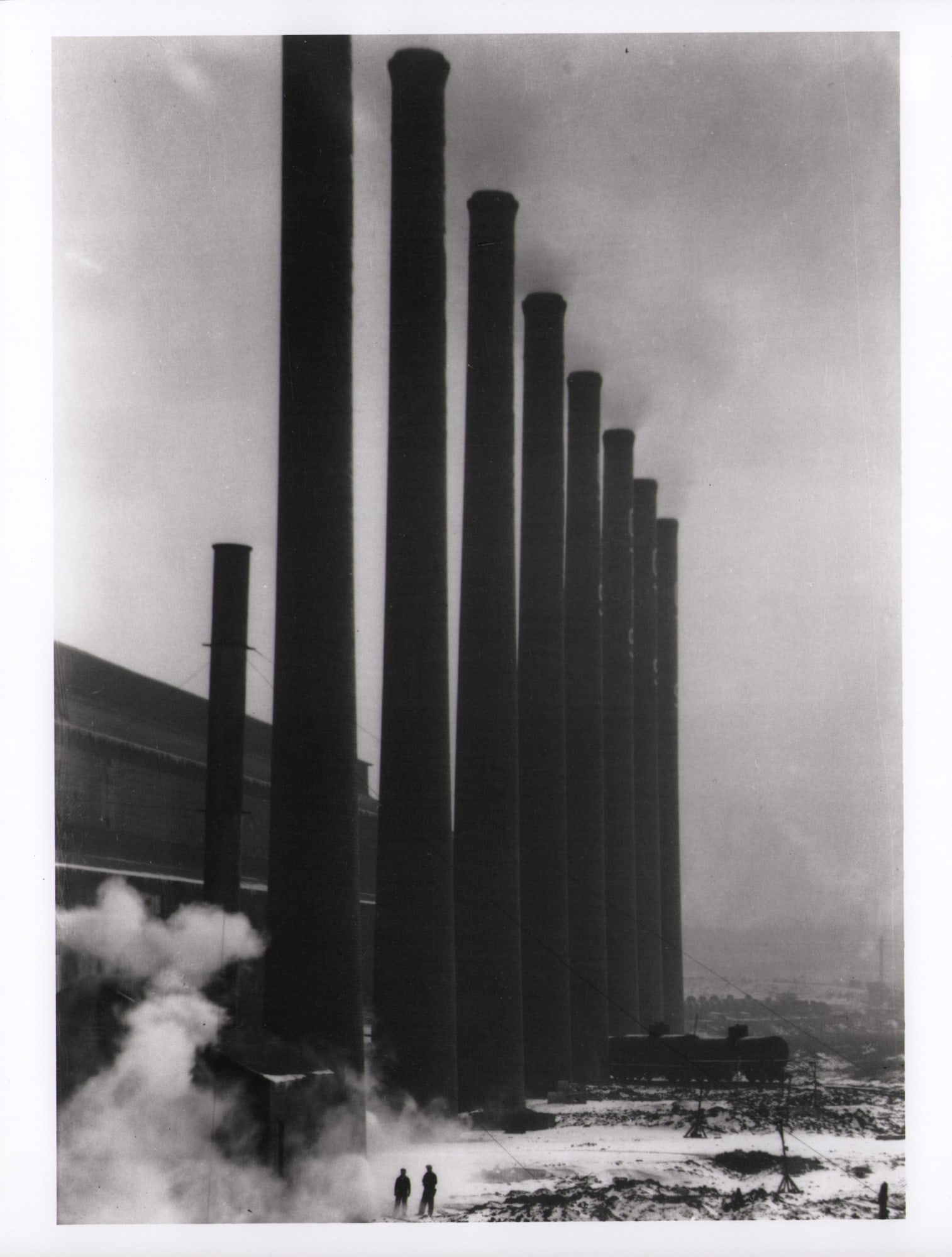 Margaret Bourke-White, "Smoke Stacks", 1928: Margaret Bourke-White (1904-1971), "Otis Street Smoke Stacks, Cleveland, Ohio", 1928, a glossy, resin-coated gelatin silver print on medium-weight paper, 20.3 × 25.4 cm, printed in the 1980s. The