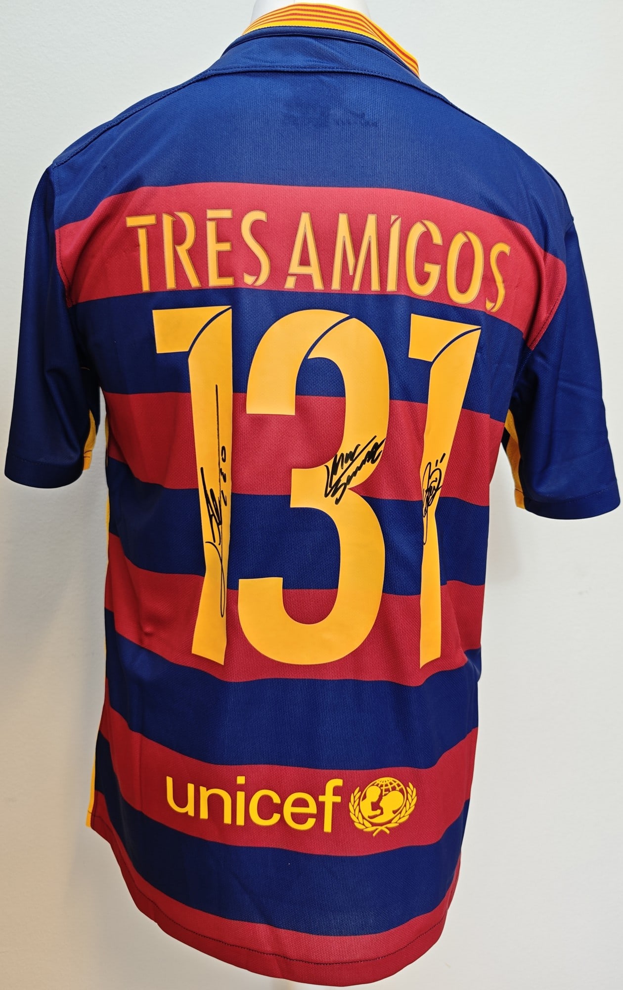 Messi, Suárez, Neymar Signed Barça 15-16 ICONS COA: Messi, Suárez & Neymar, "MSN Tres Amigos 131 Goals" FC Barcelona 2015-16 home jersey with the commemorative TRES AMIGOS #131 nameset. Signed by Lionel Messi, Luis Suárez and Neymar Jr in black marke