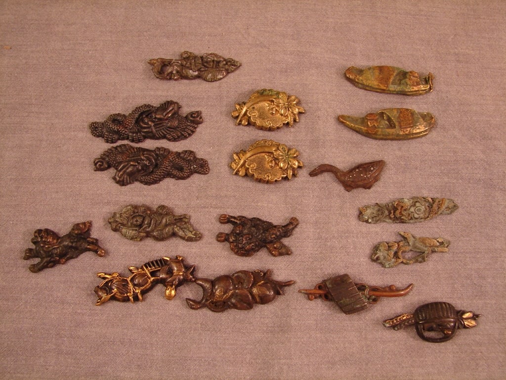 Japanese sword parts - menuki: Japanese sword parts - menuki. 17 total in this lot. Some are pairs and some singles. Some are older and some are contemporary. See photos as part of the description.