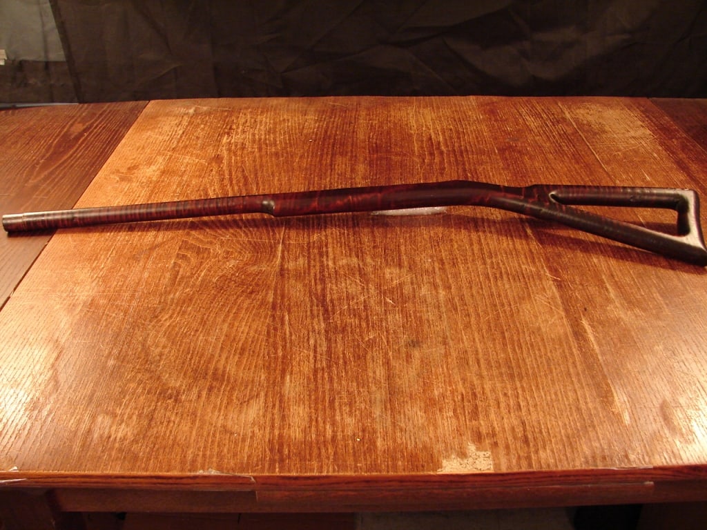 Unique walking stick made from curly maple: A unique walking stick or crutch made from curly maple. Very interesting piece at first glance thought to be a child toy gun. Possibly a crutch or walking stick with maker's or owners name "D. Fisher"