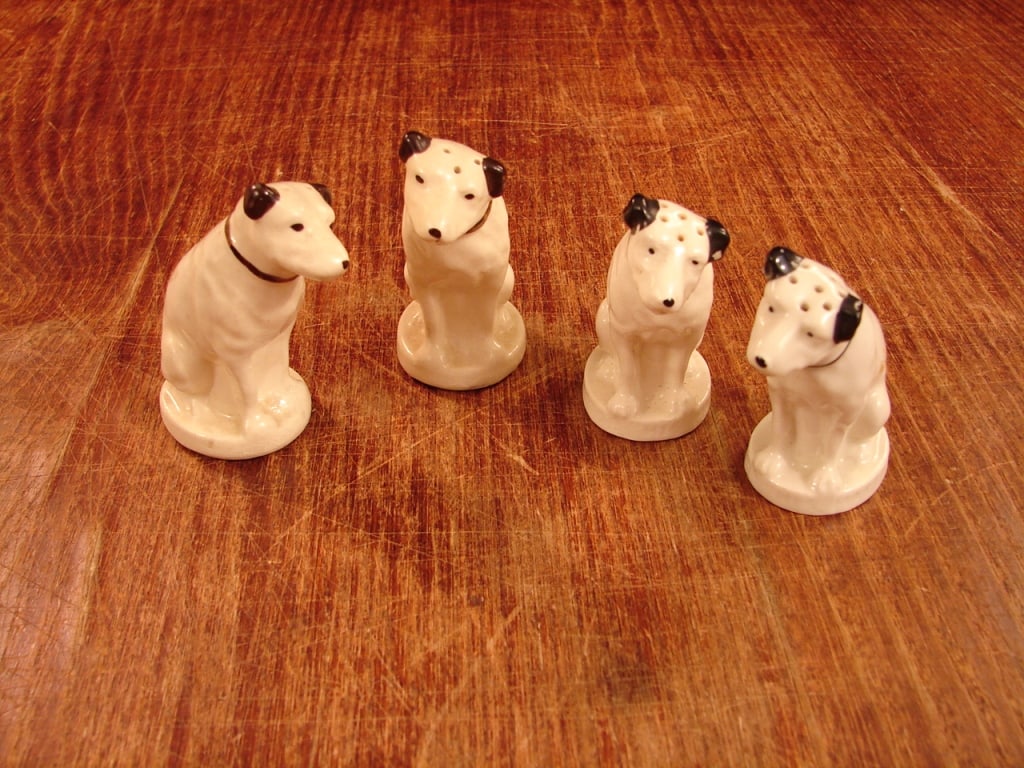 Lot of 4 Salt n Pepper RCA Dog Nipper: Lot of 4 RCA Dog Nipper salt and Pepper shakers. See photos as part of the description. two with corks, two without.