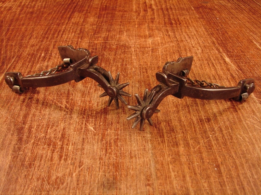 August Buermann engraved spurs.: Matching set of beautiful August Buermann engraved spurs. No leather. Great patina. Fine set indicative of the of the cowboy west..