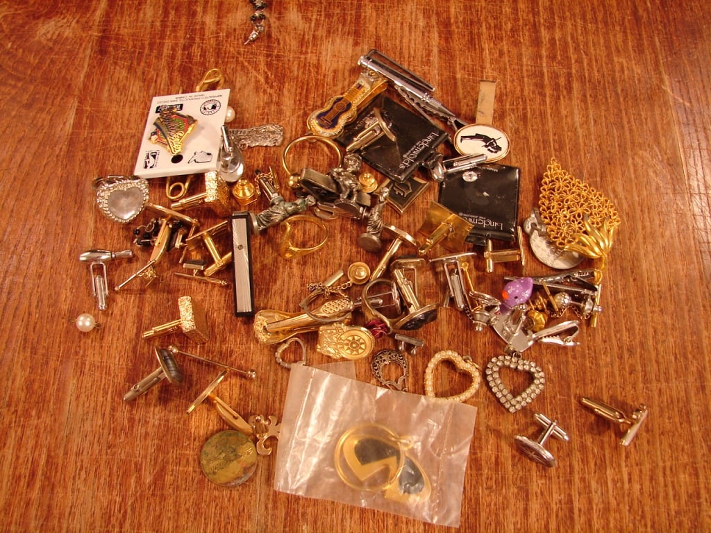Lot of estate costume jewelry. Unresearched.: Lot of estate costume jewelry as found in a jewelry box. Unresearched. Cuff links, pendants, rings, etc. See photos as part of the description. All one price.