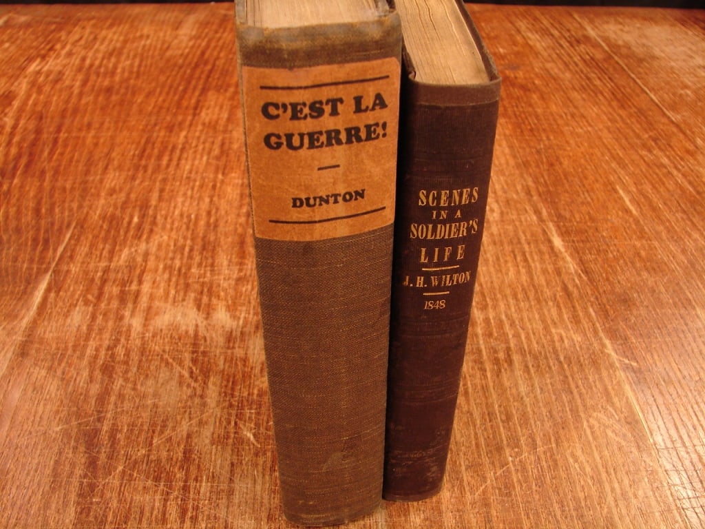 Lot of two antique Military history books WWII: Lot of two antique Military history books of WWI and much earlier British conflict in Persia (Afghanistan). 1) C'Est La Guerre. The best Stories of the World War. By James G. Dunton. 1927 2) Scenes of