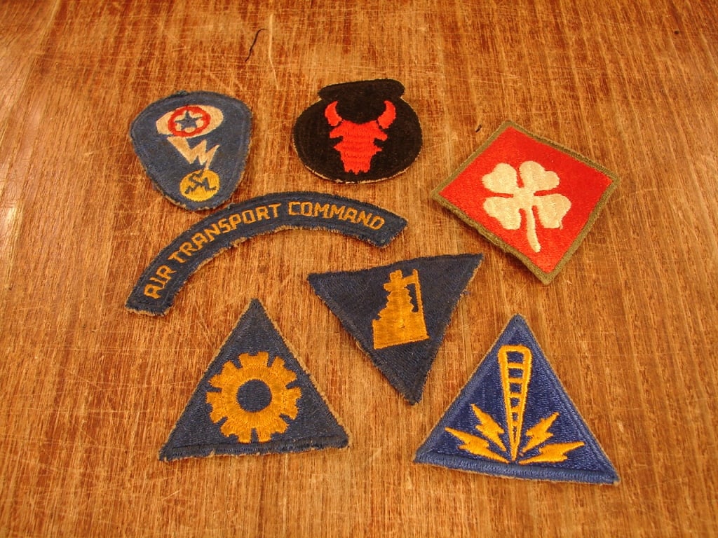 Lot of 7 WWII cloth insignias: Lot of 7 WWII cloth uniform insignias patches. 34th Division, 4th Army patch, Air Transport, Manhattan Project, Communication Specialist, and other operations patches