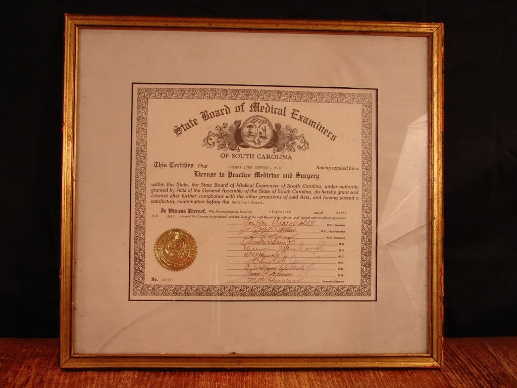 Lot of commemorative pieces Col Cherry Gaffney: Fantastic grouping. Lot of framed commemorative pieces for Col. Cherry Gaffney XVIII Airborne Corps Fort Bragg. Including South Carolina Medical License. Very fine collection and tribute to a fine