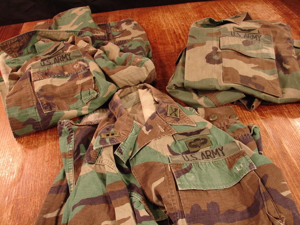 Lot of 3 US Army woodland camo jackets Special OPS: Lot of 3 US Army woodland camo jackets. Rank and special operations insignias. Two are named. Both size medium short.
