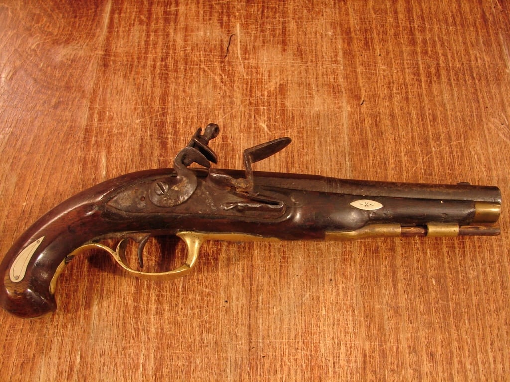 Small Continental Flintlock Pistol C. 1760-90: Small Continental Flintlock Pistol C. 1760-90. Unmarked possibly Belgium or Germany, this small pistol with a Walnut stock and brass furniture has a 6 ¾" octagon to round barrel approximately