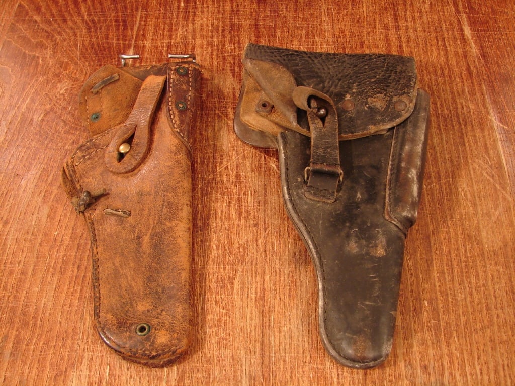 Lot of 2 Military Holsters: Lot of 2 Military Holsters. 1) WWI 1911 holster converted to open top with strap. 2) Post war German P 38 Holster.
