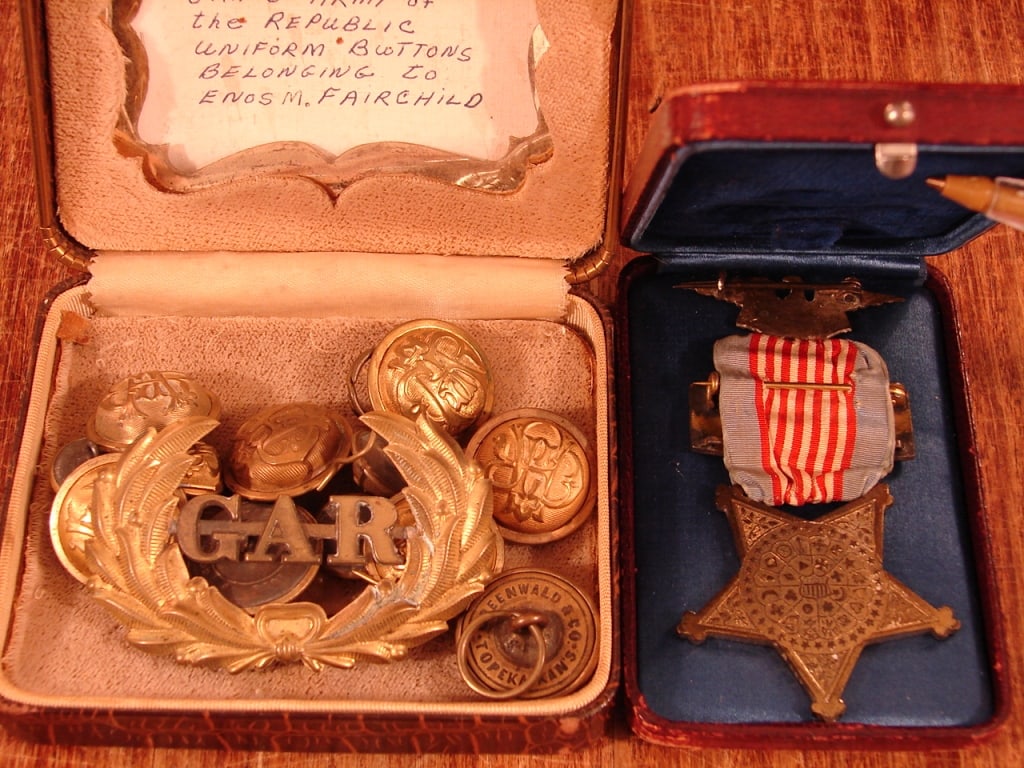 Lot of Civil War named G.A.R medals and buttons: Lot of Civil War G.A.R medals. Medals from The Grand Army of the Republic. The items belonged to Enos M. Fairchild and include an officers grade medal, hat badge and various buttons. A very nice group