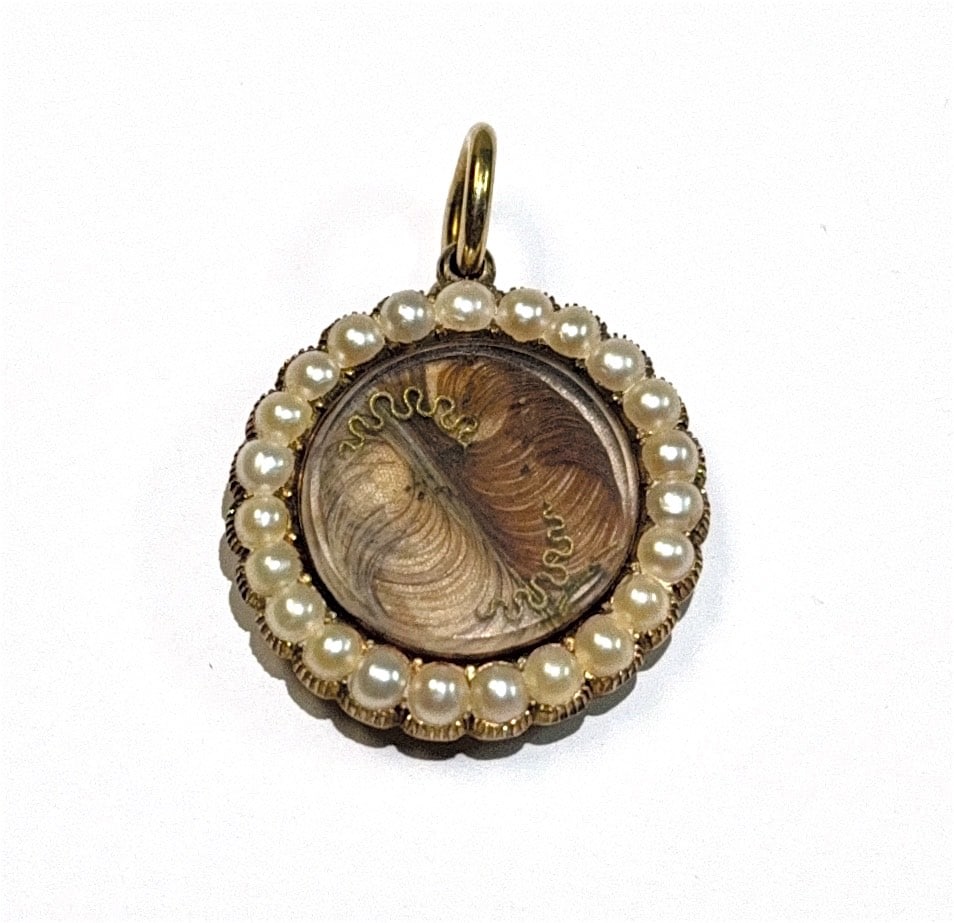Victorian Era Hair Locket 14K w/ Pearl Bezel: KEYWORDS: Mourning locket, Antique pendant, Victorian jewelry, Hairwork jewelry (or Hair art), Sentimental jewelry, Gold (or yellow gold), Pearl border (or half pearls), Keepsake, Memento, Circular lo