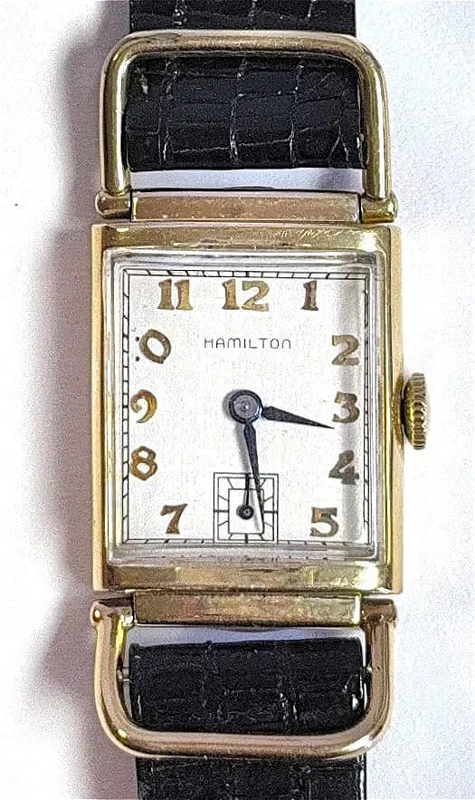 Hamilton Wilshire From 1940s Vintage Hand Winding Watch: KEYWORDS: Vintage Wristwatch, Rectangular case, Gold-filled case, Sub-seconds dial, Manual-wind Movement, Black leather strap. The Hamilton Wilshire is an iconic rectangular wristwatch first