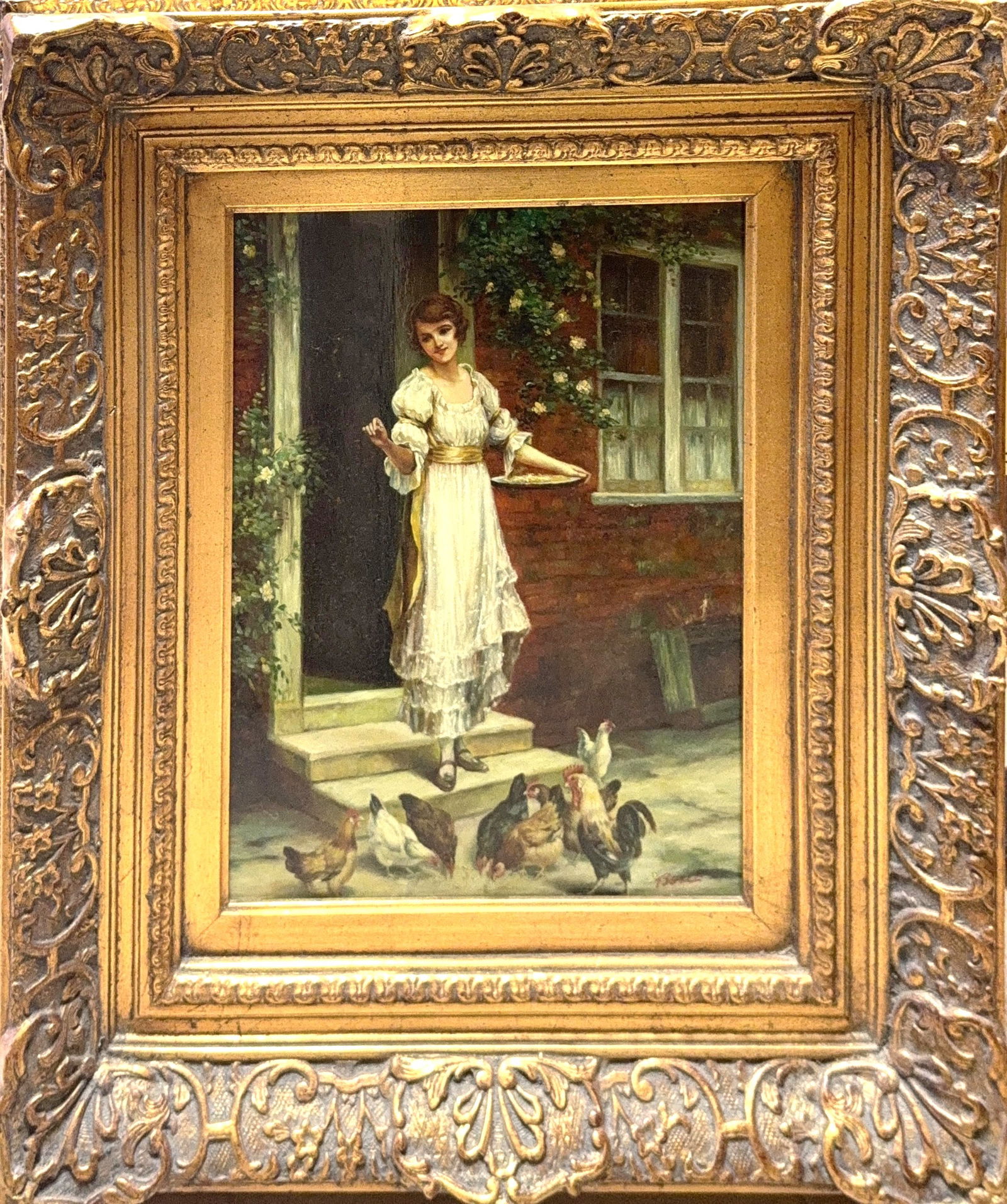 Illegible Signature , Oil on Wood board, British (20th Century): KEYWORDS: Garden setting, rustic farmhouse scene, cottage doorway, floral vines, woman feeding chickens. Young woman in a flowing white dress standing on the steps of a brick house. The girl holds a s