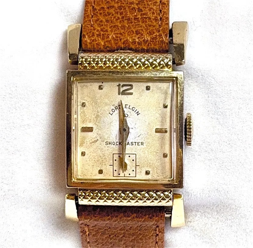 Art Deco Vintage Lord Elgin Shockmaster 14K Gold Filled Watch: Title: Art Deco Vintage Lord Elgin Shockmaster 14K Gold Filled Watch. Medium: 14K Gold Filled Watch. Condition: Good overall. The watch has consistent show of wear; still in overall good condition. De