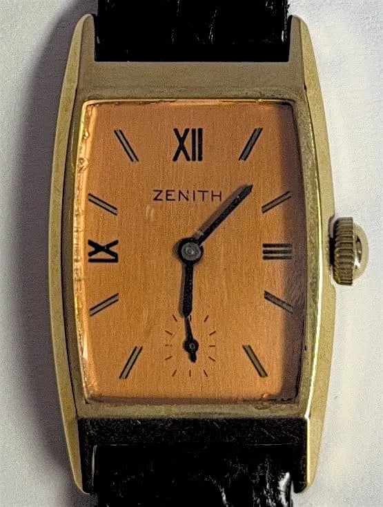 14K GOLD Zenith Art Deco From 1939 Vintage Hand Winding Watch (Under Gold Value): Title: 14K GOLD Zenith Art Deco From 1939 Vintage Hand Winding Watch (Under Gold Value). Medium: 14K Gold Watch. Dimensions: Approximately 23 mm by 39 mm. Condition: Good overall. The watch has consis