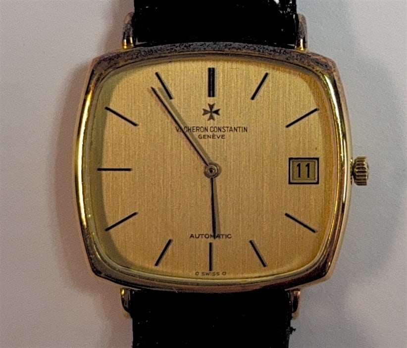 Vintage 18K Solid Yellow Gold Vacheron Constantin ultra-thin automatic dress watch (1970s): Case Shape: Vintage "TV Screen" / Cushion Shape.Metal Composition: Solid 18K Yellow Gold. Dial Details: Gold tone with a finely brushed vertical linen texture finish, black baton indices, a date windo