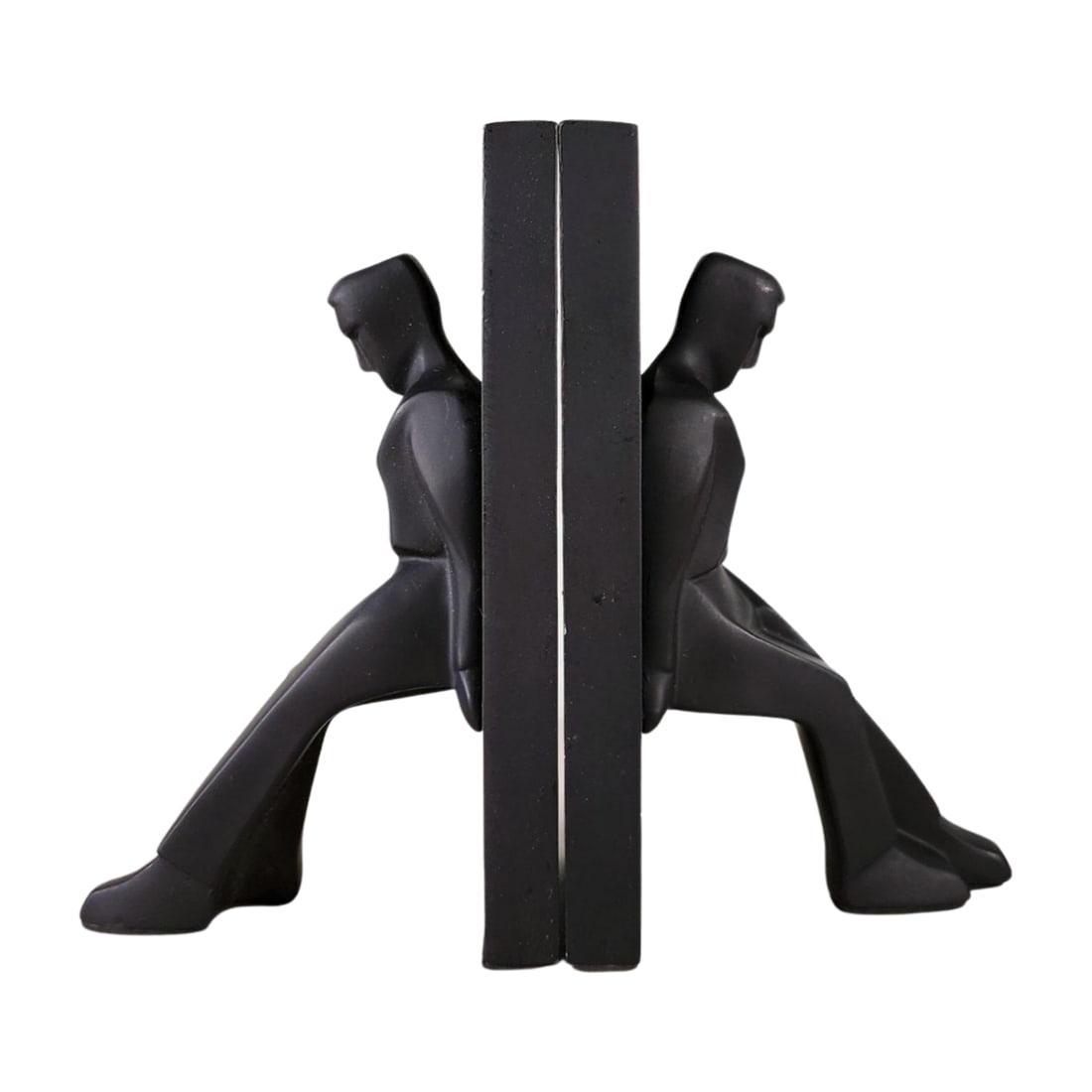 Chris Collicott for Kikkerland Modern Bookends: Chris Collicott for Kikkerland black bookends with abstract seated figures leaning against a divider. Modern, minimalist design. Measures 8 3/4" x 3 3/8" x 5 1/8".