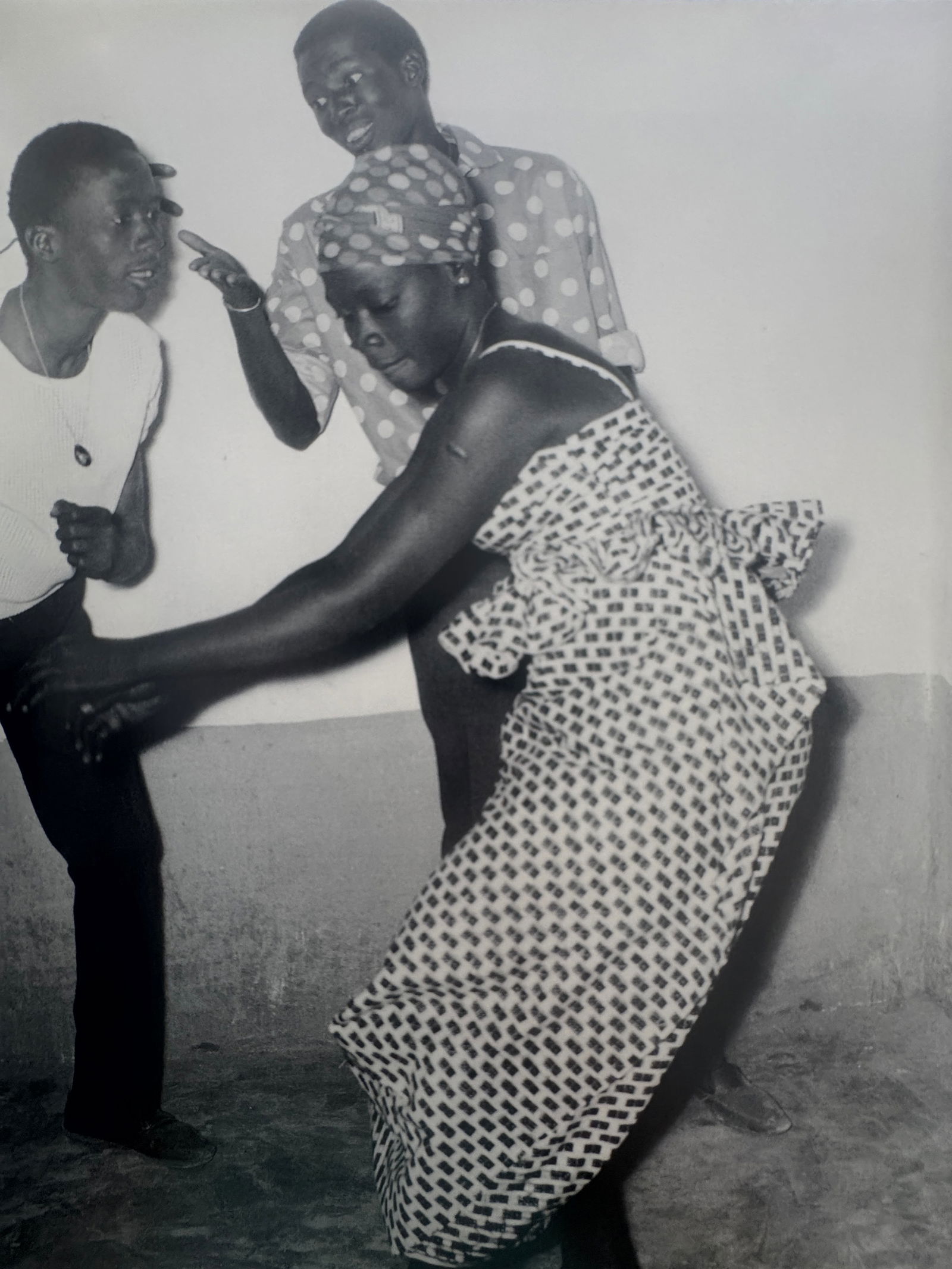 Malick Sidibe (Malian, 1935-2016): Malick Sidibe (Malian, 1935-2016). Who Dances Best?, "1965" Print. 11.10 x 8.50 inches. Printed in 1998. Please be aware that all lots in our auctions are sold "AS IS," in accordance with the Terms &