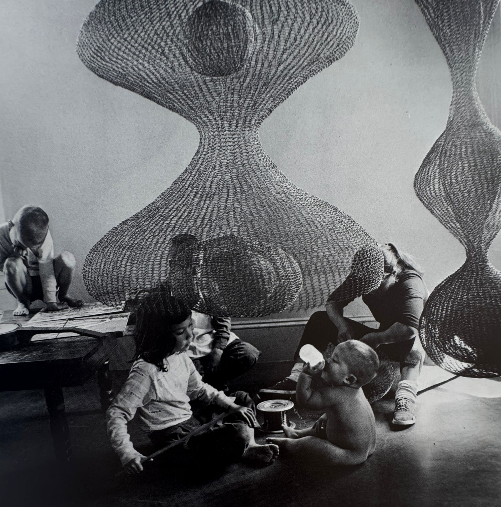 Imogen Cunningham (American, 1883-1976) Print: Imogen Cunningham (American, 1883-1976) Print. Printed in the 1970/1980's. Ruth Asawa, Sculptor, and Her Children, "1958". 6.25 x 6.25 inches. Please be aware that all lots in our auctions are sold "A