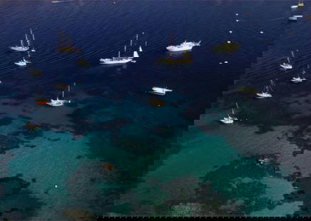 Slim Aarons (American, 1916-2006) Print: Slim Aarons (American, 1916-2006) Print. Northern Sardinian Coast, "1978". 40.00 x 60.00 inches. Please be aware that all lots in our auctions are sold "AS IS," in accordance with the Terms & Conditio