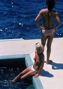 Slim Aarons (American, 1916-2006) Print: Slim Aarons (American, 1916-2006) Print. Poolside in Antibes, Hotel du Cap Eden-Roc, Antibes, France, "1976". 40.00 x 60.00 inches. Please be aware that all lots in our auctions are sold "AS IS," in a