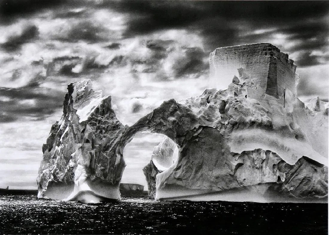 Sebastiao Salgado (Brazilian, 1944-2025) Print: Sebastiao Salgado (Brazilian, 1944-2025) Print. Iceberg Between Paulet Island and the Shetland Islands, Antarctica, "2005". Printed in 2008, Italy. 5.90 x 8.30 inches. Please be aware that all lots in