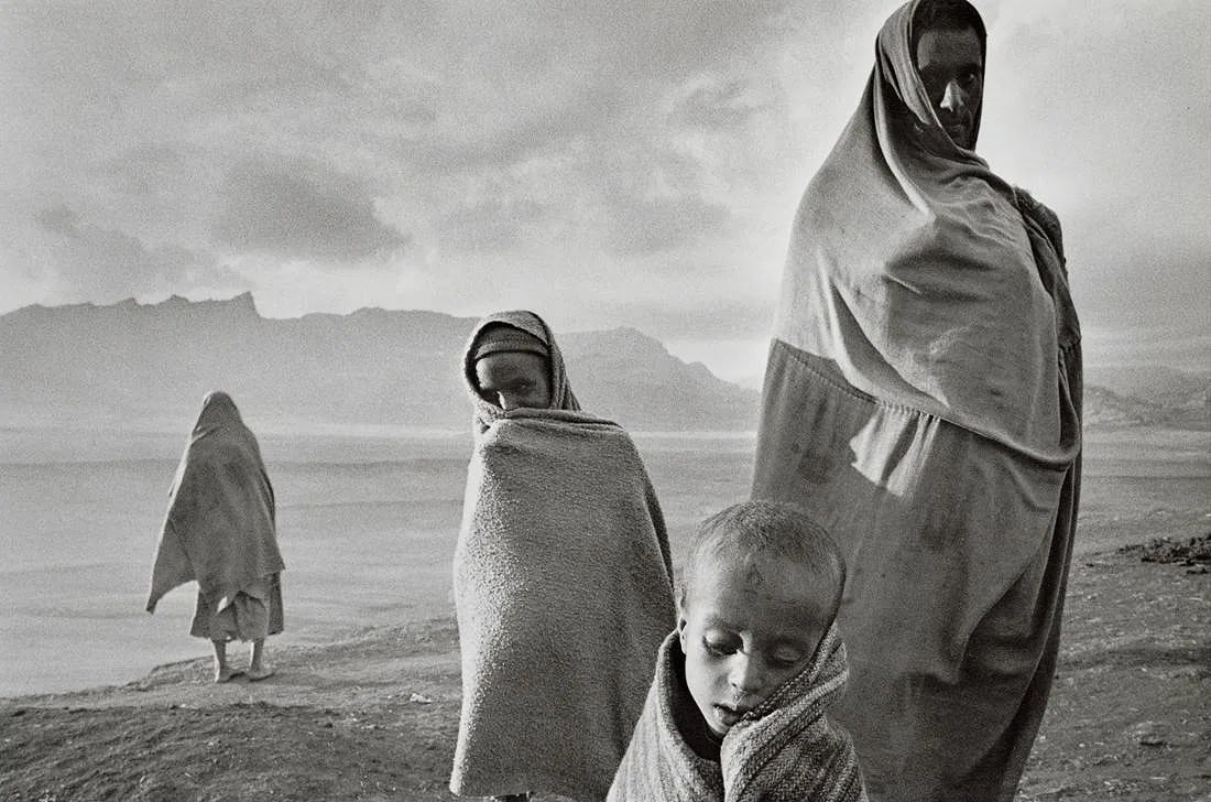 Sebastiao Salgado (Brazilian, 1944-2025) Print: Sebastiao Salgado (Brazilian, 1944-2025) Print. Refugees in Camp, Ethiopia, "1984". Printed in 1999, Italy. 9.60 x 6.35 inches. Please be aware that all lots in our auctions are sold "AS IS," in accor
