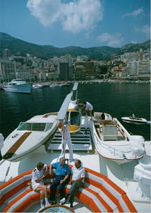 Slim Aarons (American, 1916-2006) Print: Slim Aarons (American, 1916-2006) Print. Yacht in Monte Carlo, Monte Carlo Harbour, Donzi Speedboat, "1976". Roy Carver's Yacht. 40.00 x 60.00 inches. Please be aware that all lots in our auctions are