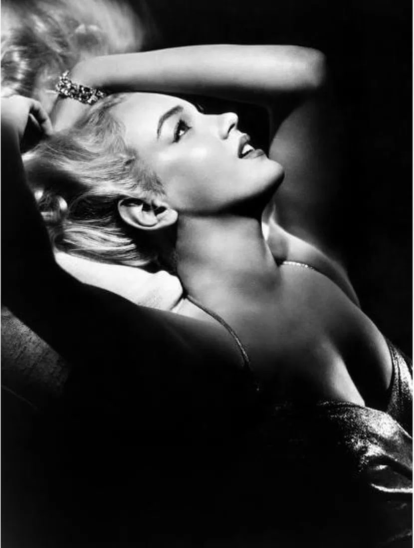 Marilyn Monroe (American, 1926-1962) Print: Marilyn Monroe (American, 1926-1962) Print. 24.00 x 32.00 inches. Please be aware that all lots in our auctions are sold "AS IS," in accordance with the Terms & Conditions of the Auction. All "dates"