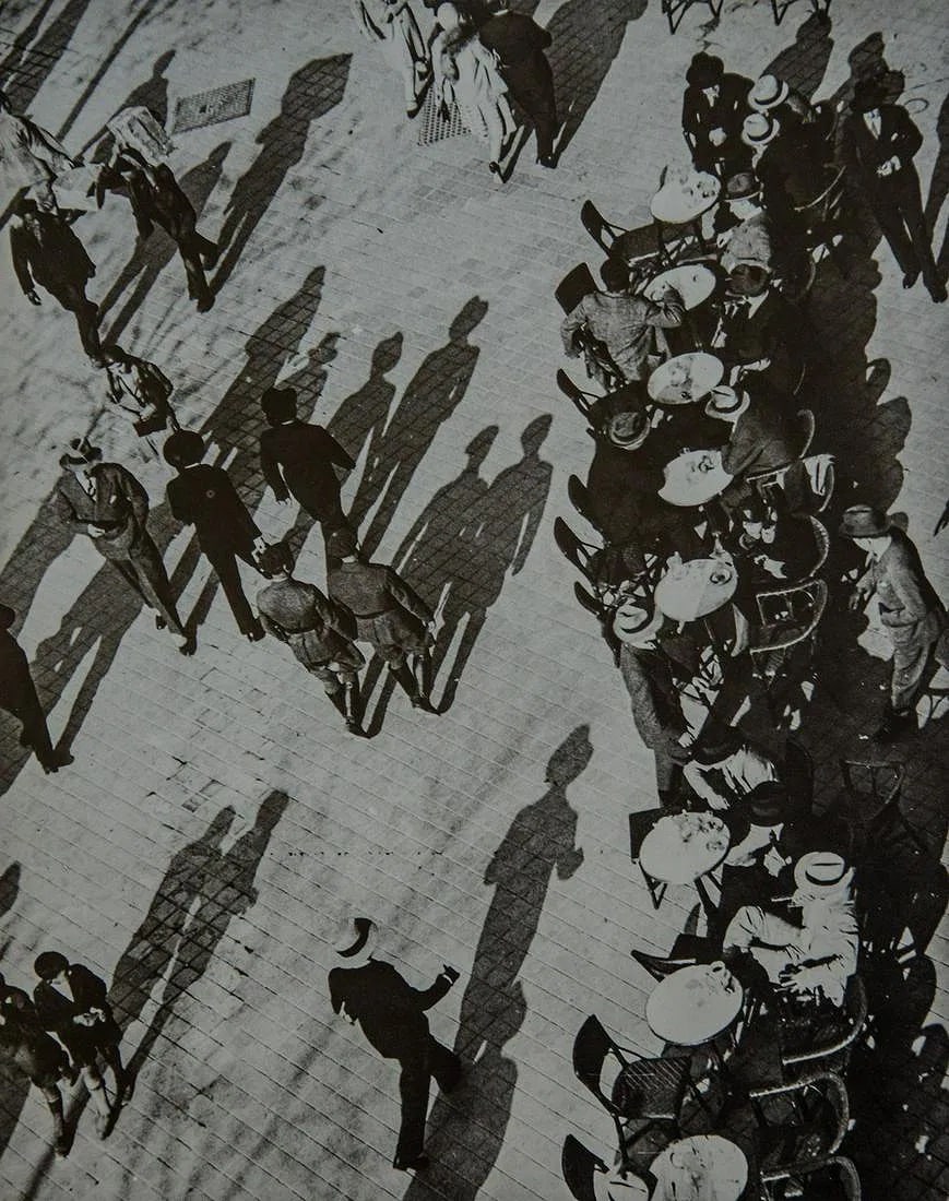 Martin Munkacsi (Hungarian-American, 1896-1963) Print: Martin Munkacsi (Hungarian-American, 1896-1963) Print. Shadow Figures Across Square. Printed in 1979, USA. 9.00 x 11.00 inches. Please be aware that all lots in our auctions are sold "AS IS," in accor