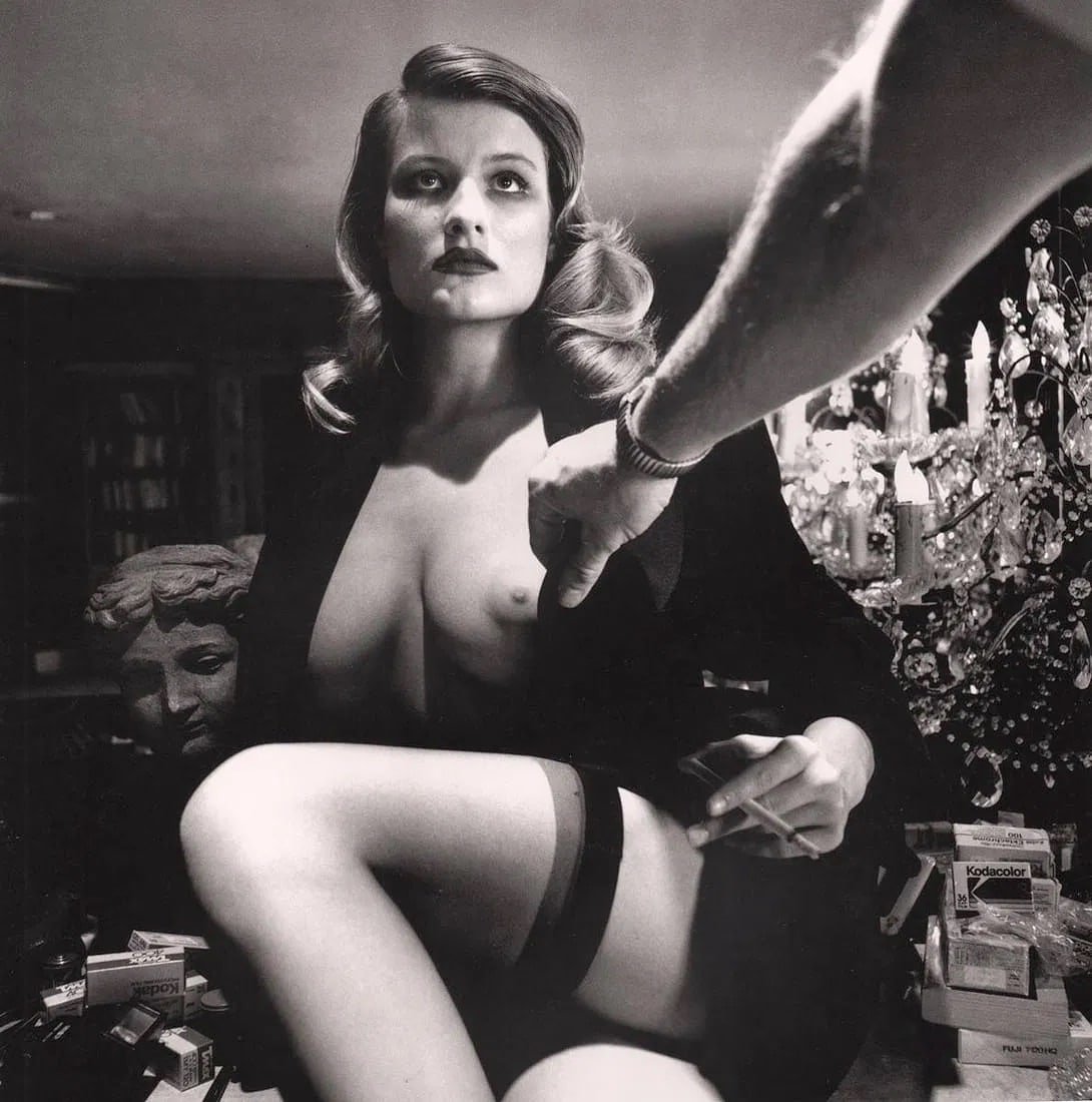 Helmut Newton (German-Australian, 1920-2004) Print: Helmut Newton (German-Australian, 1920-2004) Print. Voyeurism, American Playboy, Los Angeles, California, "1989". Printed in 2000s, Italy. 9.50 x 9.50 inches. Please be aware that all lots in our auct