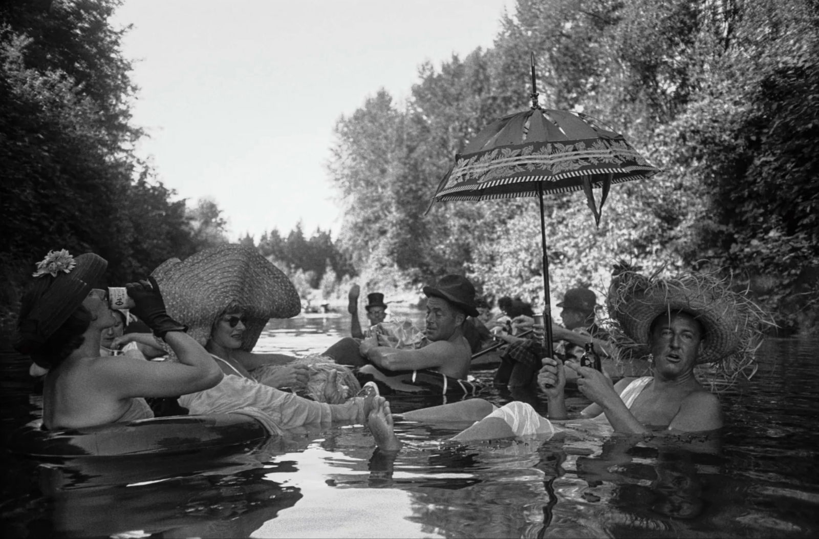 Burt Glinn (American, 1925-2008) Print: Burt Glinn (American, 1925-2008) Print. Members of the Seattle Tubing Society, "1953". 14.00 x 20.00 inches. Please be aware that all lots in our auctions are sold "AS IS," in accordance with the