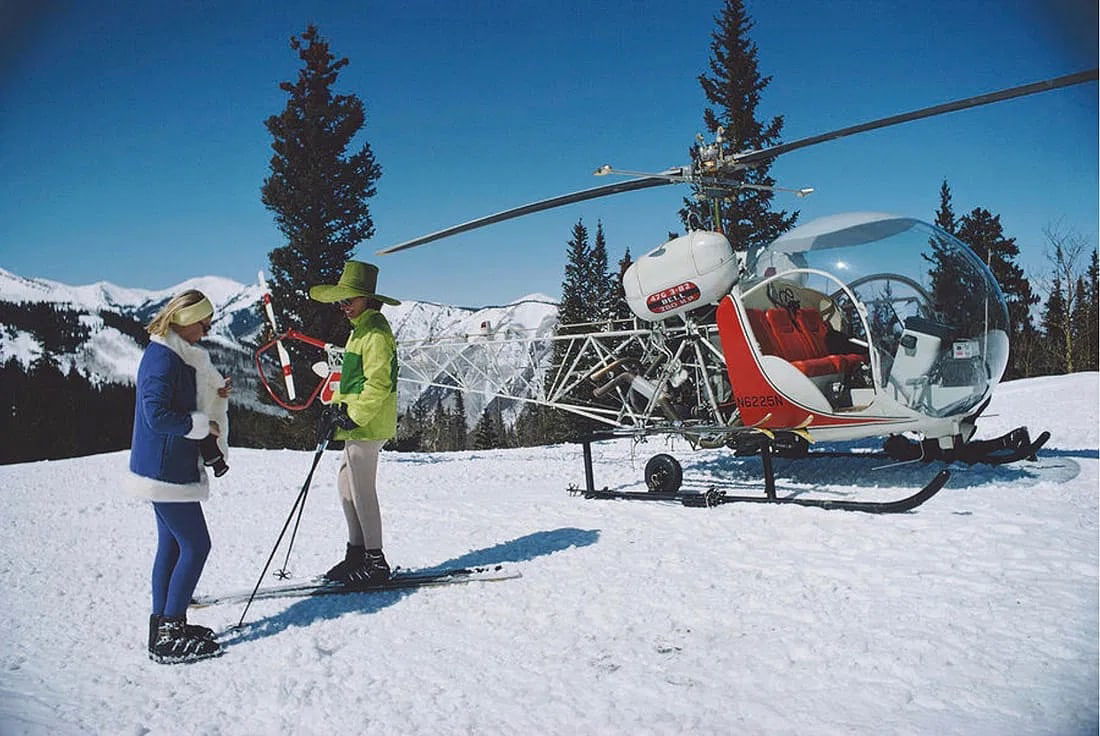 Slim Aarons (American, 1916-2006): Slim Aarons (American, 1916-2006). Snowmass Village with Helicopter. Photographic Print. 60.00 x 40.00 inches. Please be aware that all lots in our auctions are sold "AS IS," in accordance with the