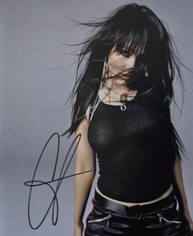 Christina Aguilera (American, b. 1980) Photograph: Christina Aguilera (American, b. 1980) Photograph. Signed in marker. Please be aware that all lots in our auctions are sold "AS IS," in accordance with the Terms & Conditions of the Auction. All