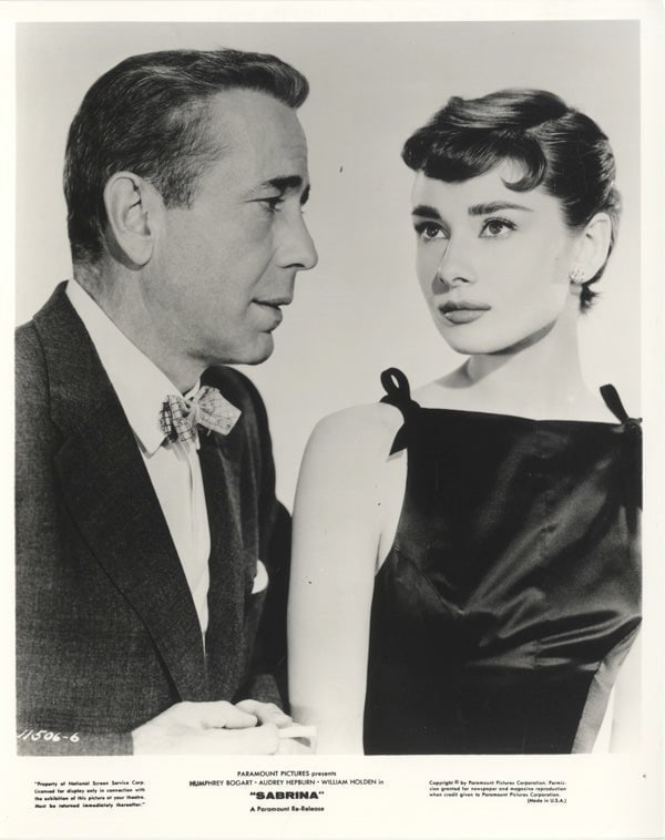 Audrey Hepburn, Humphrey Bogart Silver Gelatin: Audrey Hepburn (British, 1929–1993), Humphrey Bogart (American, 1899–1957) Silver Gelatin. 8.00 x 10.00 inches. Please be aware that all lots in our auctions are sold "AS IS," in accordance with