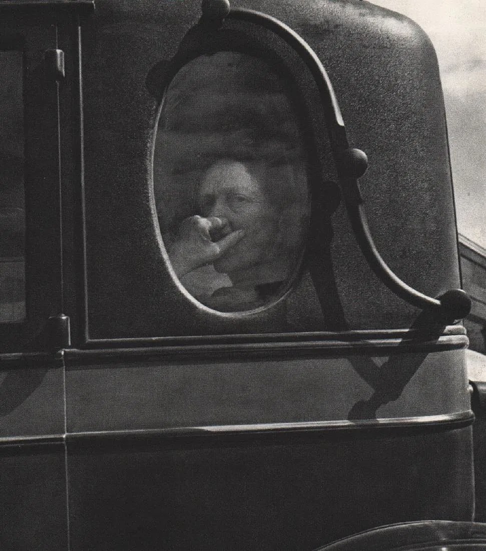 Dorothea Lange (American,1895-1965) Print: Dorothea Lange (American,1895-1965) Print. Funeral Cortege, End of an Era in a small valley town in California, "1938". Printed in 1966. 5.75 x 6.75 inches. Please be aware that all lots in our