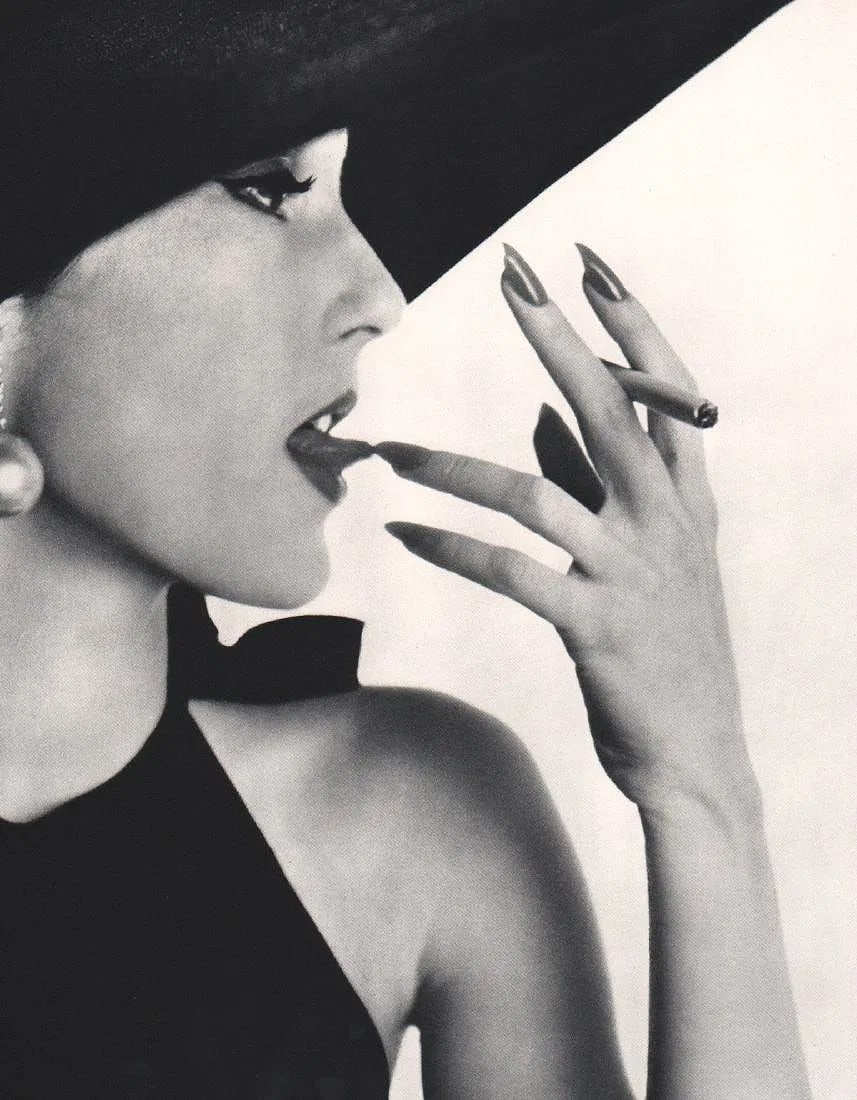 Irving Penn (American,1917-2009) Print: Irving Penn (American,1917-2009) Print. Girl with Tobacco on the tip of her tongue. Printed in 1960. 9.00 x 12.00 inches. Please be aware that all lots in our auctions are sold "AS IS," in accordance
