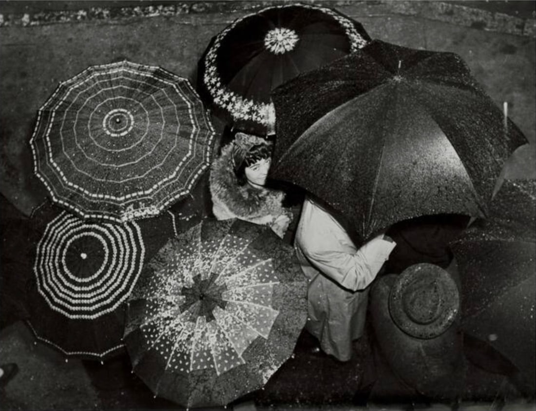 Weegee (American, 1899-1968) Print: Weegee (American, 1899-1968) Print. Umbrellas, Greenwich Village, New York, "1945". 17.50 x 12.50 inches. Please be aware that all lots in our auctions are sold "AS IS," in accordance with the Terms &