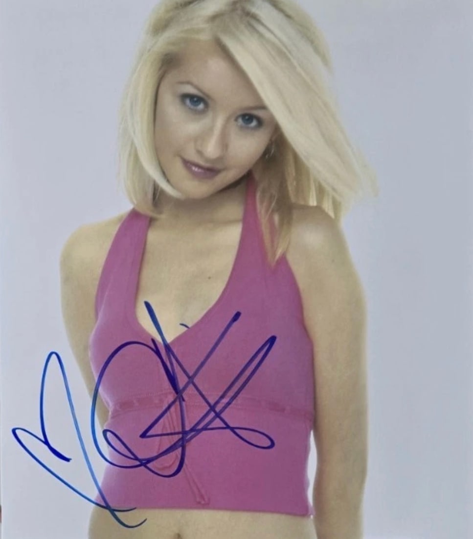 Christina Aguilera (American, b. 1980) Photograph: Christina Aguilera (American, b. 1980) Photograph. Signed in marker. Please be aware that all lots in our auctions are sold "AS IS," in accordance with the Terms & Conditions of the Auction. All