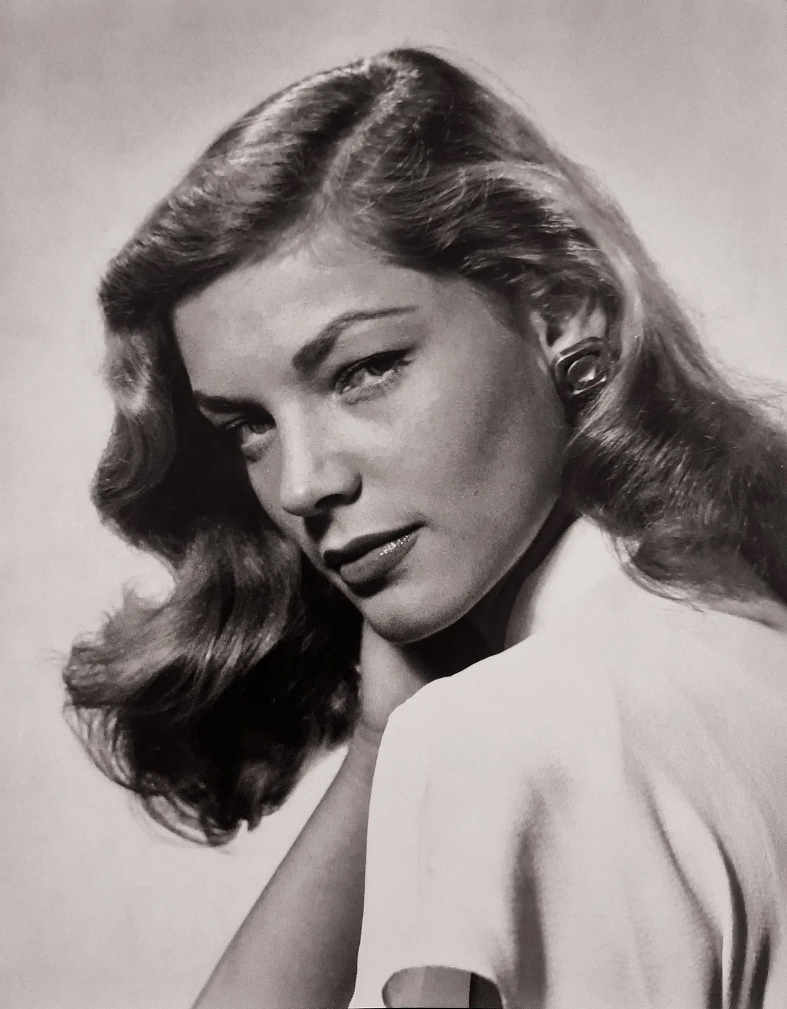 Philippe Halsman (American, 1906-1979) Print: Philippe Halsman (American, 1906-1979) Print. Lauren Bacall, "1944". Photogravure, Printed in 1998, USA. 8.00 x 10.00 inches. Not hand-signed unless otherwise stated. Lots that contain nudity have