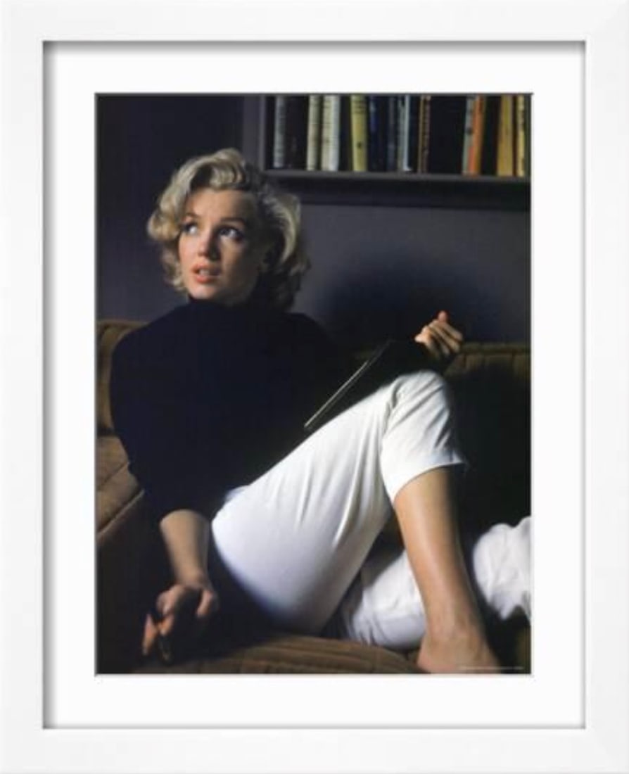 Marilyn Monroe (American, 1926-1962) Print: Marilyn Monroe (American, 1926-1962) Print. At Home. 23.50 x 30.00 inches. Glossy Photomechanical Print. Not hand-signed unless otherwise stated. Lots that contain nudity have been partially obscured
