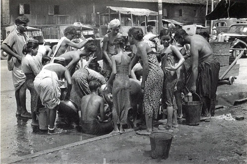 Henri Cartier-Bresson (French, 1908-2004) Print: Henri Cartier-Bresson (French, 1908-2004) Print. 1948, Water! - Rangoon, Burma. Printed in 1952. 9 x 6 inches. Not hand-signed unless otherwise stated. Photomechanical Print. Lots that contain nudity