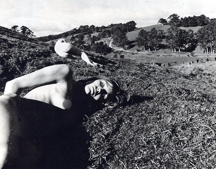 Paul Cox Print: Paul Cox Print. Nudes in field - PhotoGravure. Printed in 1975. 7 x 5.5 inches. Not hand-signed unless otherwise stated. Photomechanical Print. Lots that contain nudity have been partially obscured