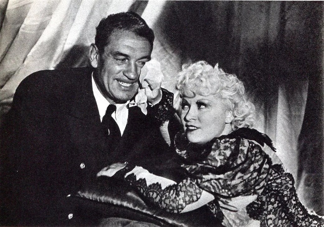 Carola Rust Print: Carola Rust Print. Klondike Lou (Mae West). Printed in 1936. 7 x 5 inches. Not hand-signed unless otherwise stated. Photomechanical Print. Lots that contain nudity have been partially obscured in the