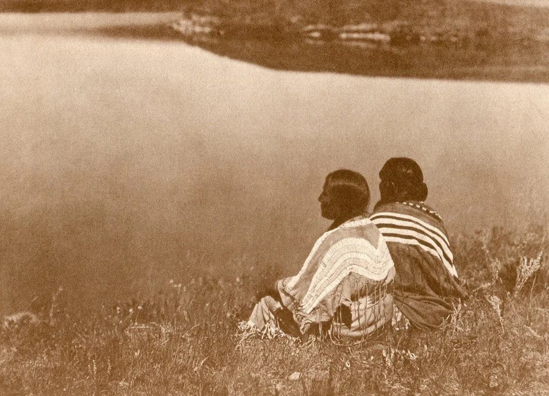 Edward S Curtis (American, 1868-1952) Print: Edward S Curtis (American, 1868-1952) Print. Two Piegan - Vintage Gravure. Printed in 1972. 9 x 6 inches. Not hand-signed unless otherwise stated. Photomechanical Print. Lots that contain nudity have
