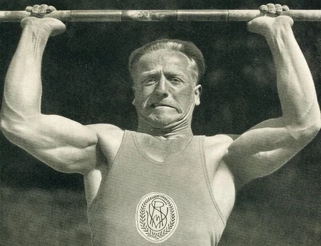 Max Schirner (German, 1891-1952) Print: Max Schirner (German, 1891-1952) Print. Weighlifter Rudolf Ismayr. Printed in 1938. 7.00 x 6.00 inches Not hand-signed unless otherwise stated. Photomechanical Print. Lots that contain nudity have