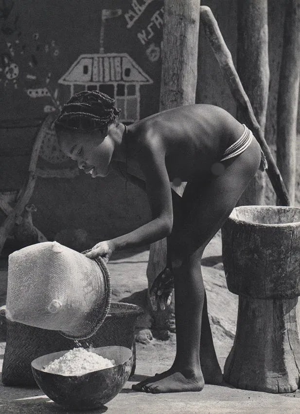 Emil Schulthess (Swiss, 1913-1996) Print: Emil Schulthess (Swiss, 1913-1996) Print. Preparing Millet Flour-Afrika. Printed in 1958. 9.5 x 12" inches Not hand-signed unless otherwise stated. Photomechanical Print. Lots that contain nudity