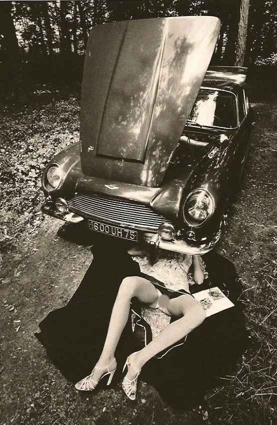 Jeanloup Sieff (French, 1933-2000) Print: Jeanloup Sieff (French, 1933-2000) Print. Under the Car-Open Bonnet. Printed in 1982.5. 75 x 8.5 inches Not hand-signed unless otherwise stated. Photomechanical Print. Lots that contain nudity have