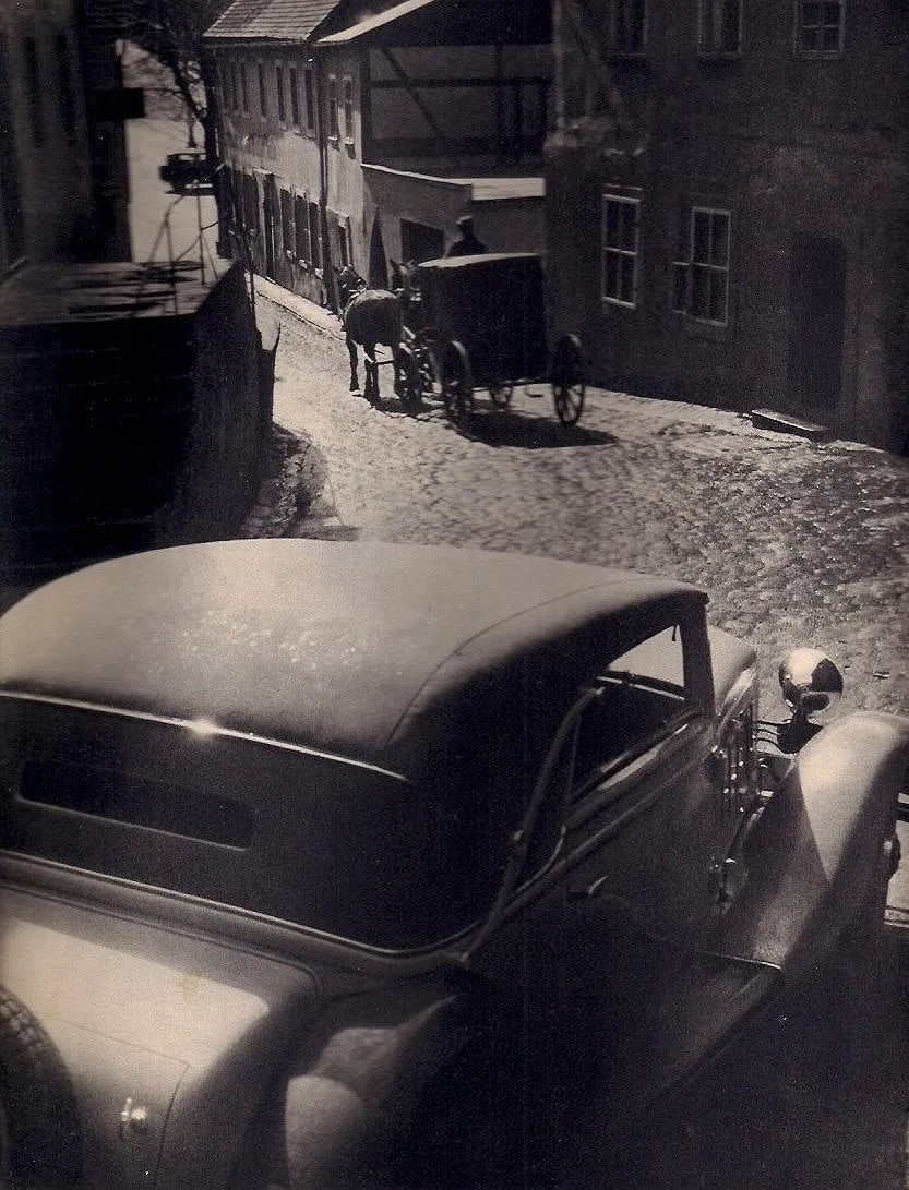 August Rambucher Print: August Rambucher Print. Cobblestone Street. Printed in 1935. 9.00 x 10.00 inches Not hand-signed unless otherwise stated. Photomechanical Print. Lots that contain nudity have been partially obscured i