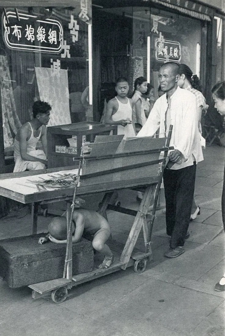 Henri Cartier-Bresson (French, 1908-2004) Print: Henri Cartier-Bresson (French, 1908-2004) Print. Street trader & Nanking Son. Printed in 1956. 6.50 x 9.50 inches Not hand-signed unless otherwise stated. Photomechanical Print. Lots that contain nudi